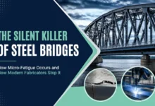 Modern steel bridge fabrication showing how robotic welding and advanced testing help prevent micro-fatigue in steel bridges.